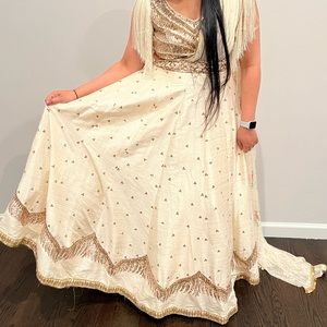 Beautiful ivory raw silk lehenga. Attached drape / trail..
